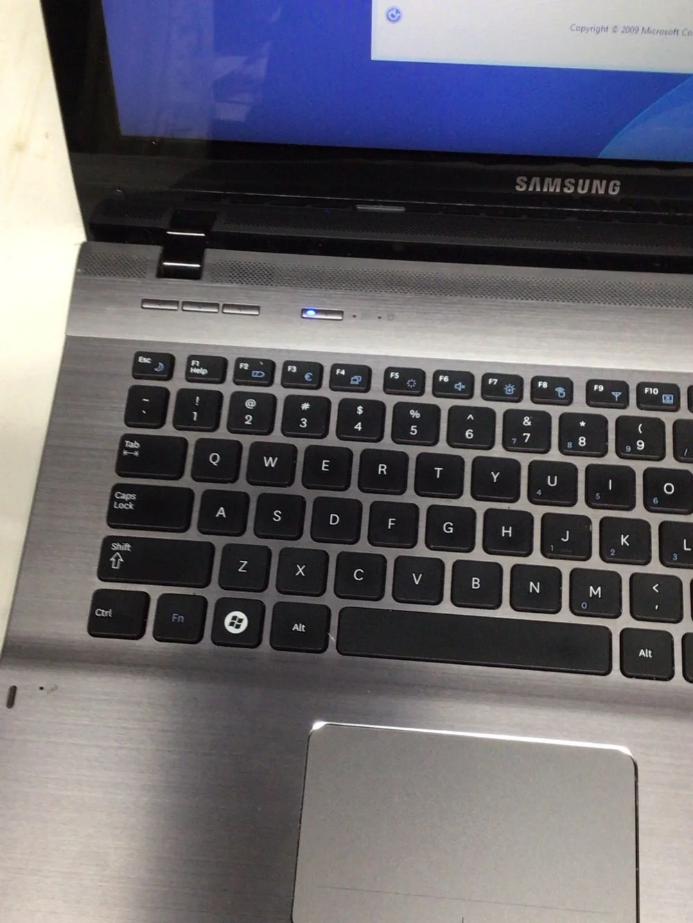 Samsung Silver and Black Laptop with Windows 7 Setup Screen